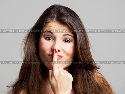 Studio portrait of a beautiful and expressive young woman. Стоковое фото, агентство Ingram Publishing / Фотобанк Лори