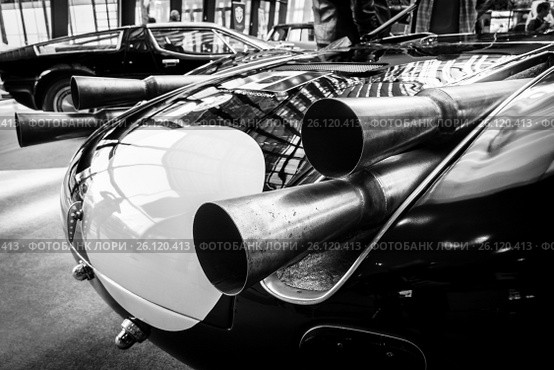 STUTTGART, GERMANY - MARCH 02, 2017: Exhaust pipes of a sports racing car Maserati Tipo 63 (Birdcage), 1959. Scuderia Serenissima. Black and white. Europe's greatest classic car exhibition "RETRO CLASSICS" Редакционное фото, фотограф Sergey Kohl / Фотобанк Лори