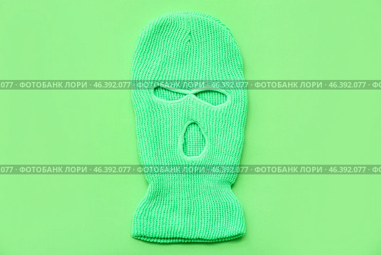 Stylish balaclava on green background. Стоковое фото, фотограф Pixel_shot / Фотобанк Лори
