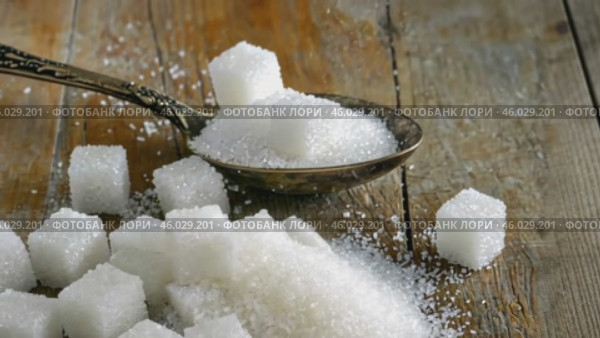 Sugar pile in a metal spoon on a wood surface. White granulated sugar and cubes. Natural seasoning. Refined sugar poured on wooden rustic table. Sugary sand. Cooking, cosmetology, spa services concept. Стоковое AI-видео, аниматор Марина Демидюк / Фотобанк Лори