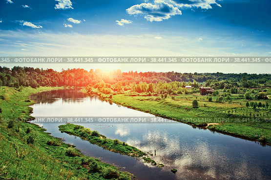 Sunset cuts through the clouds over the river Volga. Rzhev. Стоковое фото, фотограф Алексей Сорокин / Фотобанк Лори