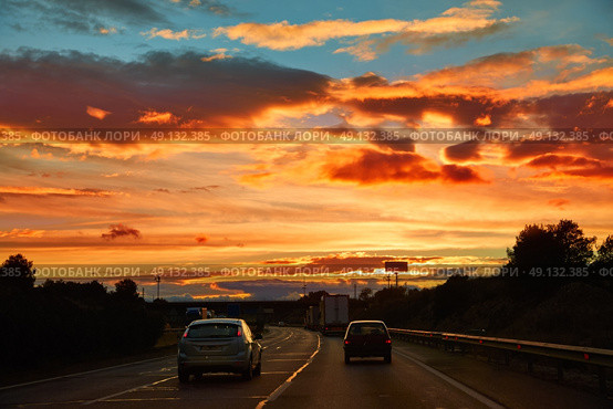 Sunset sky at AP-7 highway autovia road in Valencia at Mediterranean spain. Стоковое фото, агентство Ingram Publishing / Фотобанк Лори