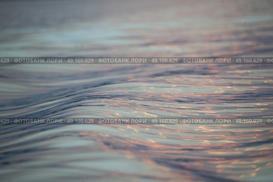 Surface of the water on the Lake at dusk, Lake of The Woods, Ontario, Canada. Стоковое фото, агентство Ingram Publishing / Фотобанк Лори