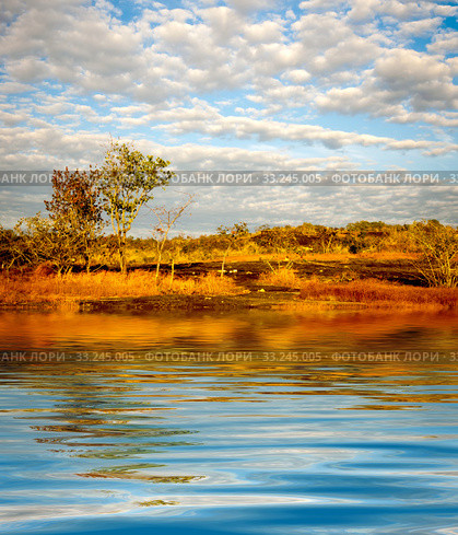 Surface Rippled of water with clouds and sky background. Стоковое фото, фотограф Phongkit Longthong / Smarterpix / Фотобанк Лори