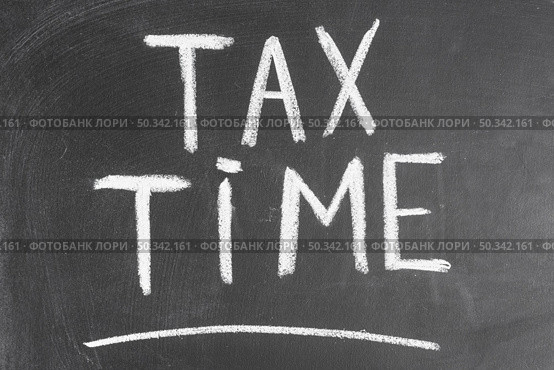 tax time written black backboard with chalk. Стоковое фото, агентство Ingram Publishing / Фотобанк Лори