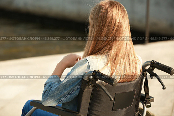 Teenage girl in wheelchair near river. Стоковое фото, фотограф Pixel_shot / Фотобанк Лори