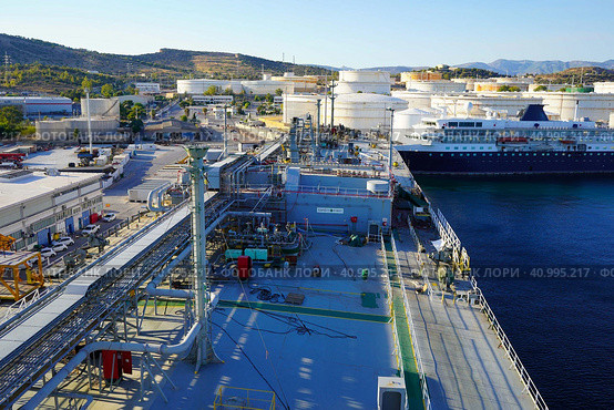 Terminal for loading gas onto ships. LNG equipment near sea Port terminal. Berth for unloading liquefied gas. Supply of liquefied gas. Стоковое фото, фотограф Ирина Старикова / Фотобанк Лори