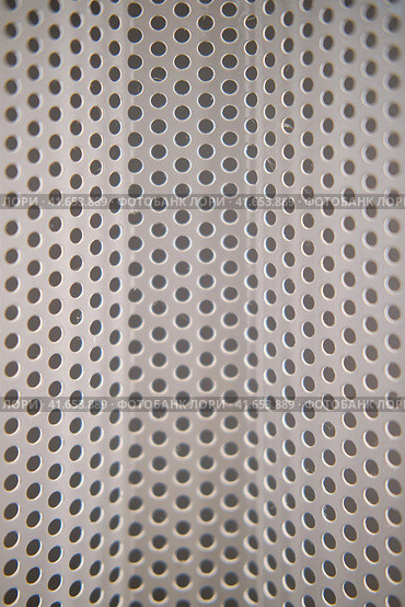 Texture bars with a metal surface and a uniform round holes. Стоковое фото, фотограф Андрей Журавлев / Фотобанк Лори