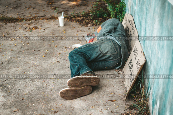 The beggars lay on their side of the street with dirty clothes. Стоковое фото, агентство Ingram Publishing / Фотобанк Лори