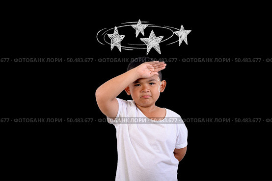 The boy is confused, not knowing where to go. Стоковое фото, агентство Ingram Publishing / Фотобанк Лори