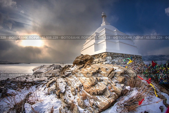 The Buddhist Stupa of Enlightenment in winter in sunny day at Ogoy Island, Baikal Lake , Russia. Стоковое фото, фотограф Алексей Колганов / Фотобанк Лори