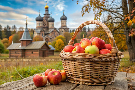 The concept of the Russian Orthodox holiday yablochny spas. A beautiful wicker basket made of vines with red ripe apples on the background of an Orthodox church. Стоковое AI-изображение, AI-художник Photojuli / Фотобанк Лори