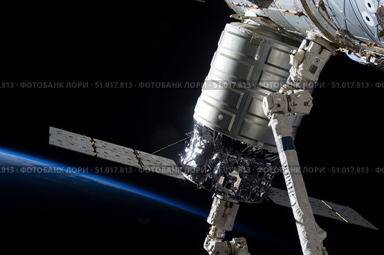 The Cygnus spacecraft attached to the Harmony Node in the grasp of Canadarm2. Стоковое фото, фотограф Stocktrek Images, Inc. / ТАСС / Фотобанк Лори