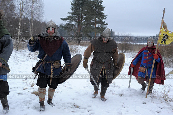 The festival is a historical reconstruction of the Viking Age in winter. Vikings attack with shields and helmets (2014 год). Редакционное фото, фотограф Анна Кривицкая / Фотобанк Лори