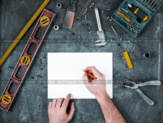 The set of construction tools on wooden background. The set of construction tools on wooden table. Стоковое фото, агентство Ingram Publishing / Фотобанк Лори