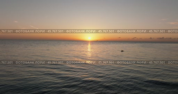 The sunset paints the sky over the tranquil lake with a warm afterglow. Стоковое видео, видеограф Степанов Григорий / Фотобанк Лори