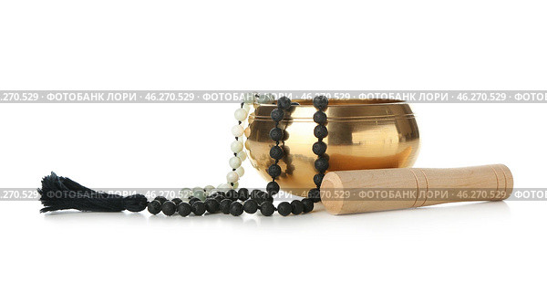 Tibetan singing bowl with beads on white background. Стоковое фото, фотограф Pixel_shot / Фотобанк Лори