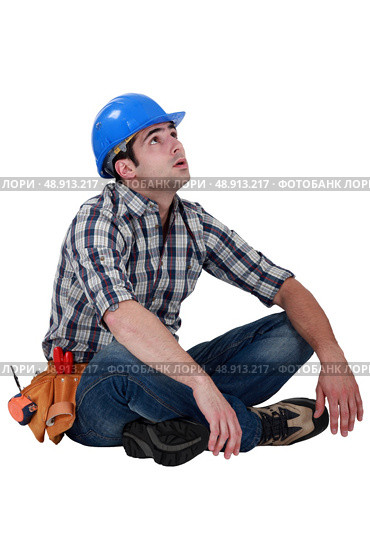 Tired builder taking well earned break. Стоковое фото, агентство Ingram Publishing / Фотобанк Лори