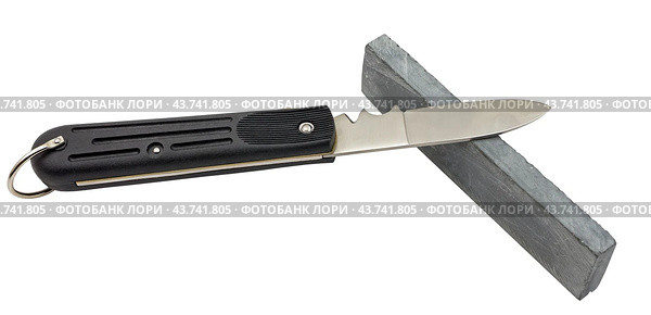 Точило и нож на белом фоне. A sharpener and a knife on a white background. Стоковое фото, фотограф Татьяна Д / Фотобанк Лори