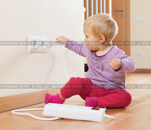 Toddler playing with electrical extension. Стоковое фото, фотограф Яков Филимонов / Фотобанк Лори