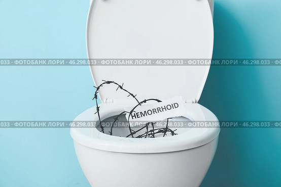 Toilet bowl with barbed wire on color background. Hemorrhoids concept. Стоковое фото, фотограф Pixel_shot / Фотобанк Лори