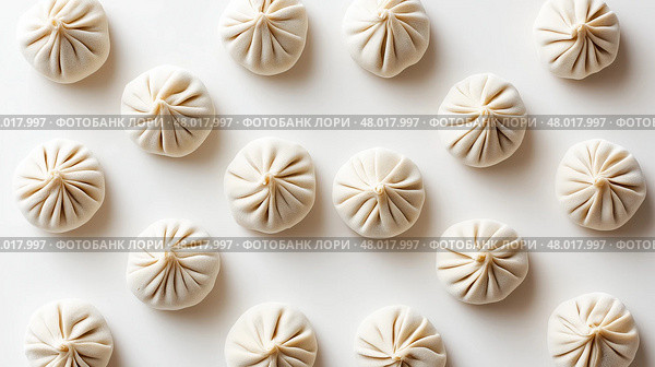 Top Down View of Raw Dumplings Evenly Arranged on White Background. Вид сверху вниз на сырые пельмени, равномерно разложенные на белом фоне. Стоковое AI-изображение, AI-художник Katsiaryna Repich / Фотобанк Лори