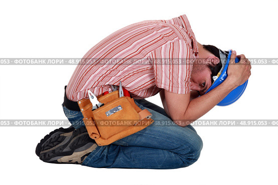 Tradesman grieving. Стоковое фото, агентство Ingram Publishing / Фотобанк Лори