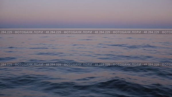 Tranquil Ocean Sunset View Over Calm Waters in Serene Location. Стоковое AI-видео, аниматор Юлия Гапеенко / Фотобанк Лори