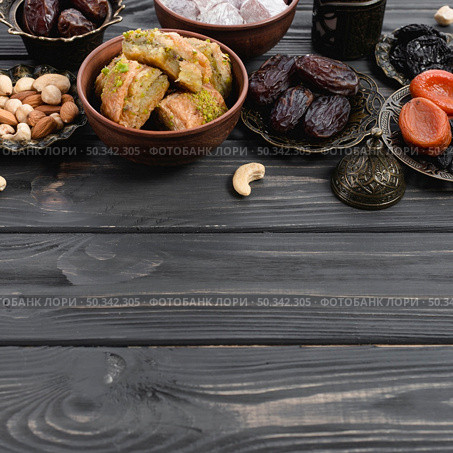 turkish delight baklava sweets dried fruits nuts wooden desk. Стоковое фото, агентство Ingram Publishing / Фотобанк Лори