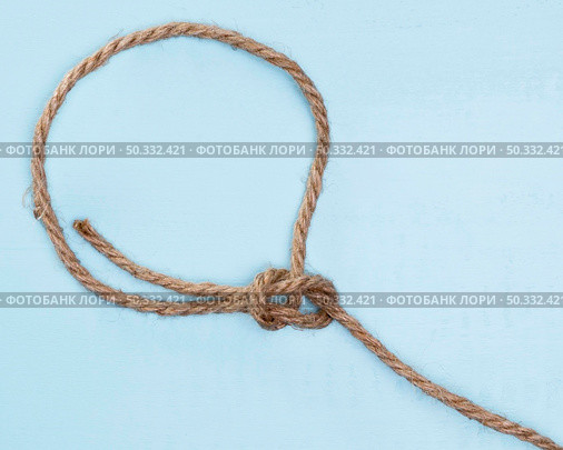 twine strong beige rope simple knot. High resolution photo. twine strong beige rope simple knot. High quality photo. Стоковое фото, агентство Ingram Publishing / Фотобанк Лори