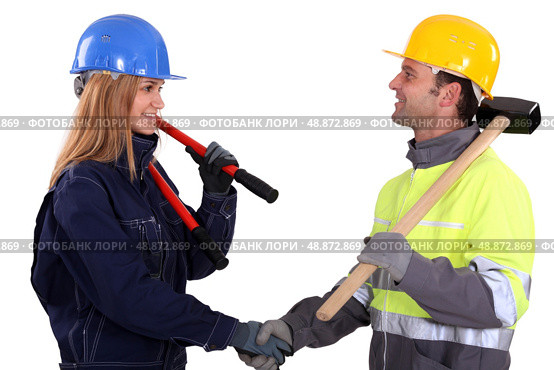 two construction workers shaking hands. Стоковое фото, агентство Ingram Publishing / Фотобанк Лори