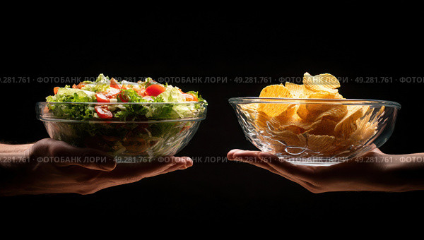 Two people holding up bowls of food, one of which is a salad. Стоковое AI-изображение, AI-художник Ярославский Максим / Фотобанк Лори
