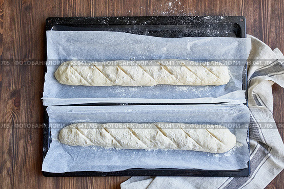 Two raw dough for a French baguette. Proofing of yeast dough before baking. Стоковое фото, фотограф Natalia Gdovskaia / Фотобанк Лори