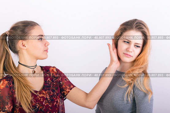 Two young woman fighting, a slapping in the face. Стоковое фото, фотограф Сергей Сергеев / Фотобанк Лори