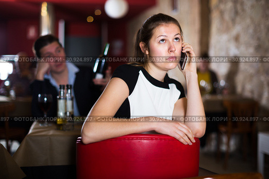 Unhappy woman talking on phone. Стоковое фото, фотограф Яков Филимонов / Фотобанк Лори