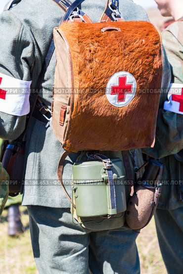 Unidentified re-enactors dressed as German military paramedic with a red cross brassard and medical bag. Стоковое фото, фотограф FotograFF / Фотобанк Лори