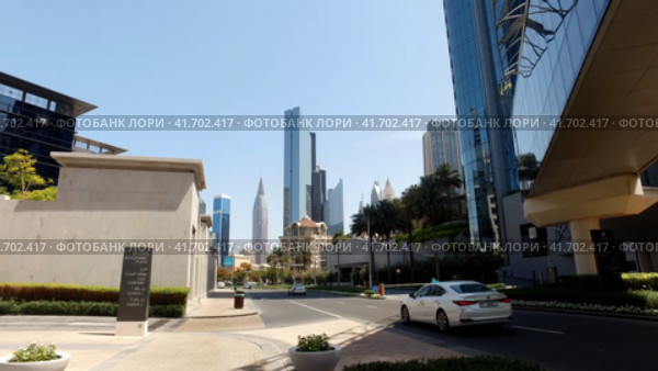 United Arab Emirates - 28 May 2023: Panoramic view of urban modern street with cars of Dubai city, UAE. Urban cityscape of business district. Редакционное видео, видеограф Aleksandr Golubev / Фотобанк Лори