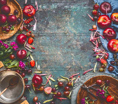 Various summer fruits and berries: strawberries, peaches, plums, cherries, gooseberries and currants on rustic kitchen table with cooking pot and spoon, top view, frame. Seasonal local organic food. Стоковое фото, агентство Ingram Publishing / Фотобанк Лори