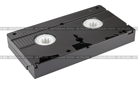 Видеокассета формата VHS на белом фоне. VHS videotape is isolated on a white background. Стоковое фото, фотограф Татьяна Д / Фотобанк Лори