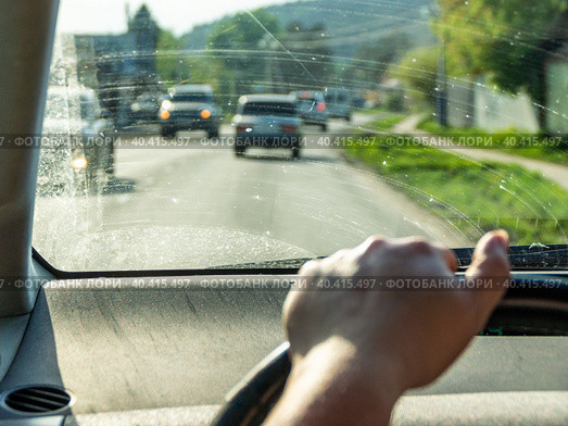 view from behind the wheel of a dirty windshield, selective focus. Стоковое фото, фотограф Дмитрий Коростылев / Фотобанк Лори