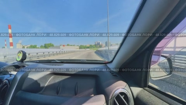 View from the front passenger seat of the car while driving on the highway. Russia. Moscow 05/25/2025. Стоковое видео, видеограф Ярославский Максим / Фотобанк Лори