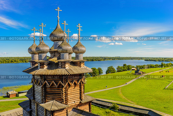 View of Kizhi Island from the bell tower. In the foreground Orthodox Church of the Intercession of the Virgin in Kizhi Pogost. Kizhi island, Onega lake, Karelia, Russia. (2016 год). Редакционное фото, фотограф Михаил Аккуратoв / Фотобанк Лори