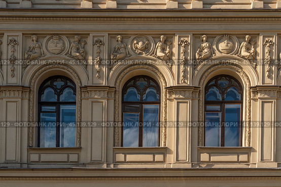 View of the exterior stucco decoration of the apartment house of the merchant Ritz-A-Porto (formerly owned by Marquis Alexander Paullucci) on the Moika River embankment, St. Petersburg, Russia. Стоковое фото, фотограф Ula Ulachka / Фотобанк Лори