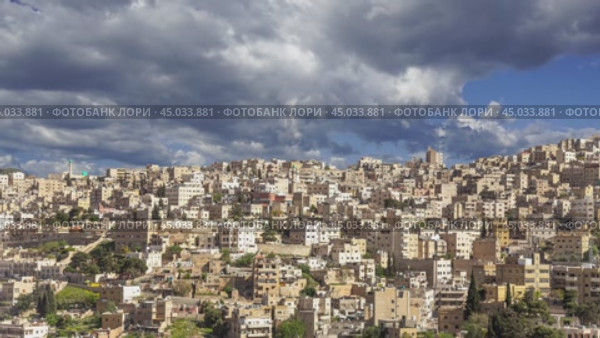 View of the modern houses Amman, Jordan, Middle East. Against the background of a beautiful sky with clouds. Стоковое видео, видеограф Владимир Журавлев / Фотобанк Лори