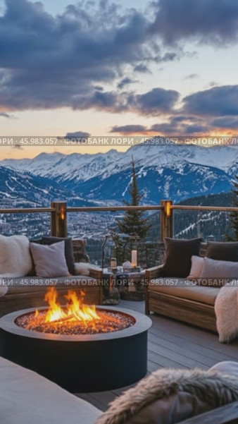 Warm fire pit burning on a terrace overlooking snowy mountains at sunset. Стоковое AI-видео, аниматор Юрий Поздников / Фотобанк Лори