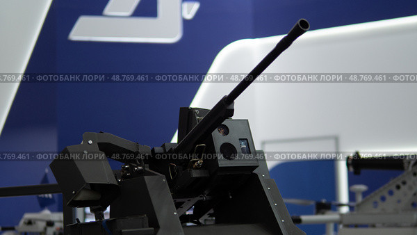 Weaponry Displays Showcasing Advanced Gun Technology in a Modern Military Exhibition Held in a Convention Center During the Latest Defense Conference. Стоковое фото, фотограф Громов Александр / Фотобанк Лори