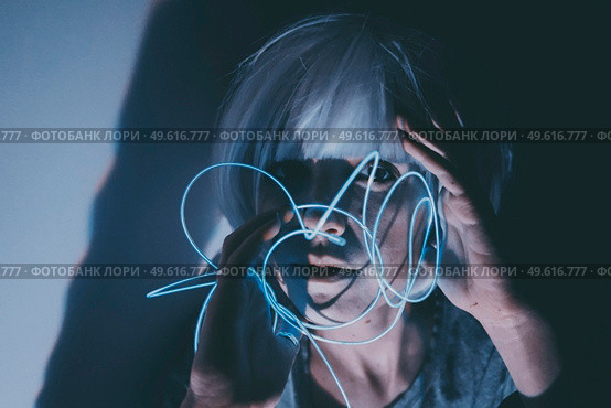 Weird dystopian theme portrait with blue neon lights. Стоковое фото, агентство Ingram Publishing / Фотобанк Лори