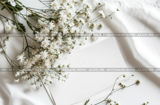white paper template and pictures of white apsara flowers on a white table. Стоковое AI-изображение, AI-художник Юлия Гапеенко / Фотобанк Лори