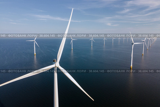 Wind turbine from aerial view, Drone view at windpark westermeerdijk a windmill farm in the lake IJsselmeer the biggest in the Netherlands,Sustainable development, renewable energy. Стоковое фото, фотограф Fokke Baarssen / Фотобанк Лори