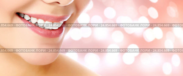 Woman smile closeup against an abstract background. Стоковое фото, фотограф Nobilior / Фотобанк Лори
